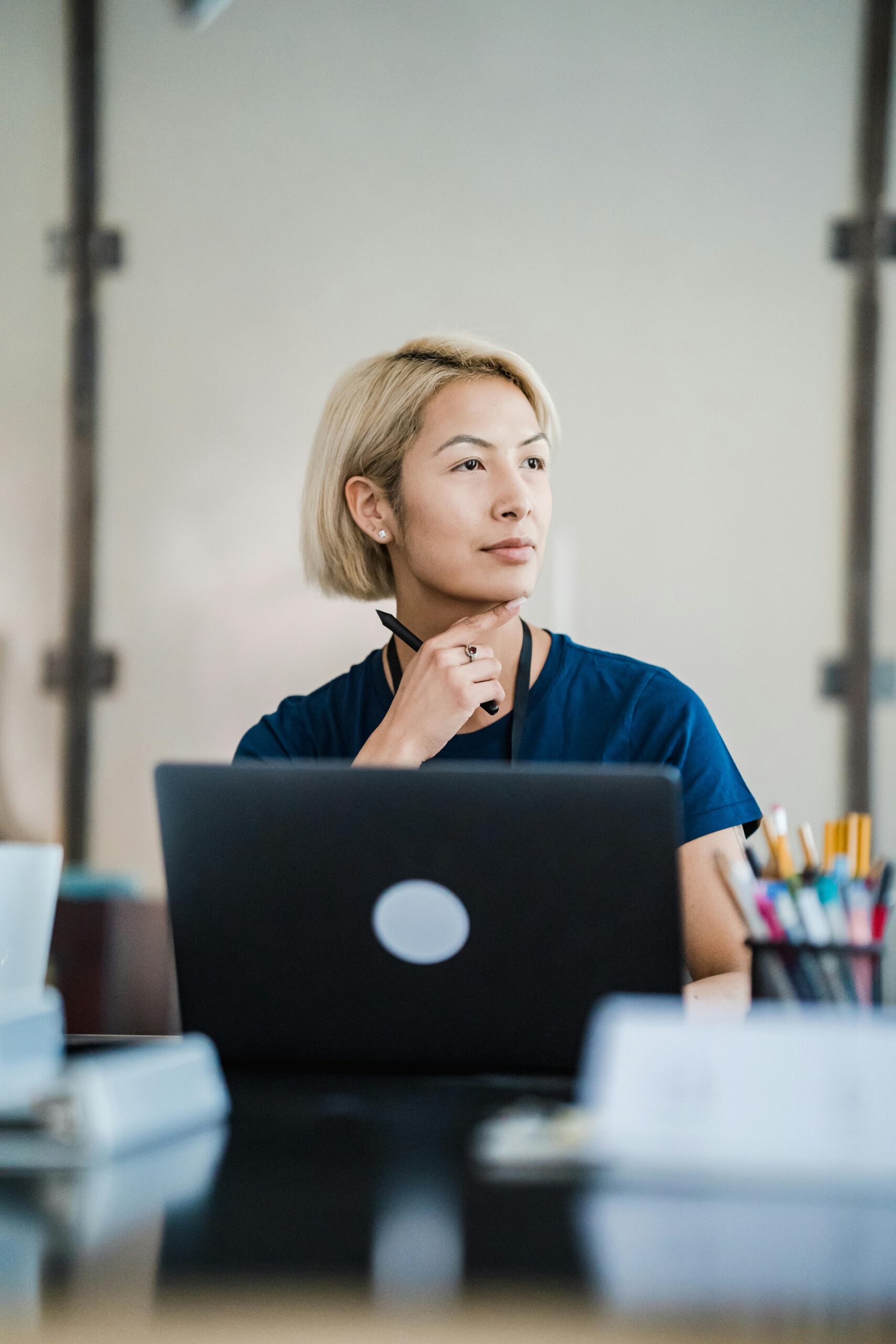 Professional working on a laptop in a modern office